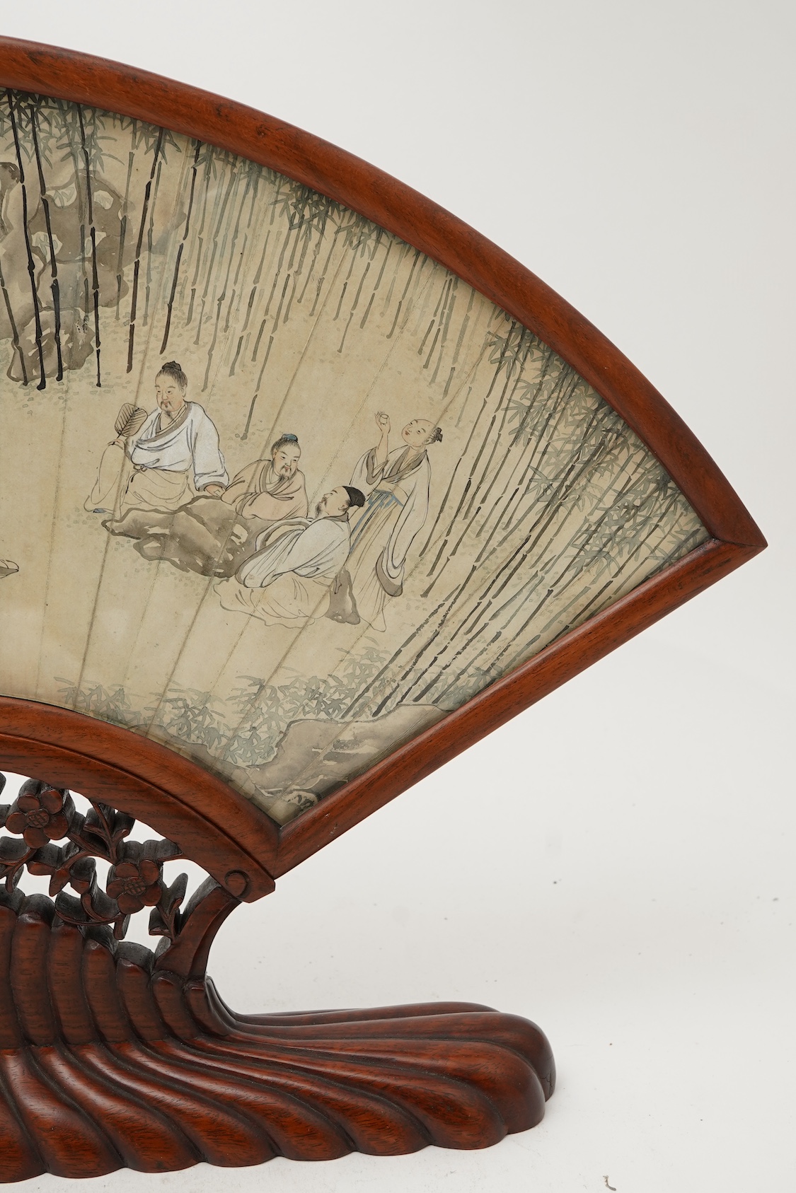 A Chinese painted paper fan leaf, 19th century, with hongmu frame and stand, early 20th century
